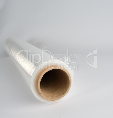 coiled roll of transparent polyethylene for food packaging