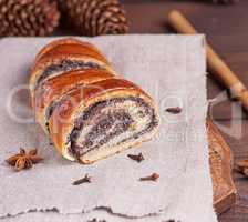baked roll with poppy seeds