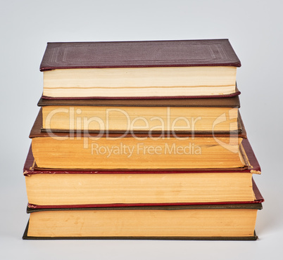 stack of books in hardcover and yellow pages