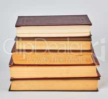 stack of books in hardcover and yellow pages