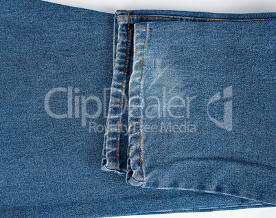 fragment of blue folded jeans