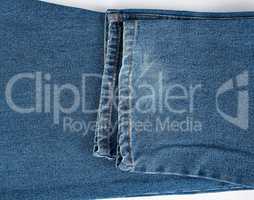 fragment of blue folded jeans