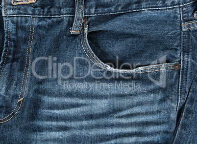 frayed empty front pocket of blue jeans