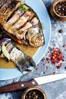 Tasty baked fish on plate