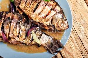 Tasty baked fish on plate