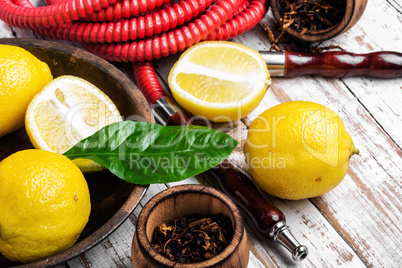 Smoking hookah with lemon flavor