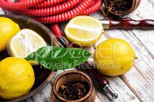Smoking hookah with lemon flavor
