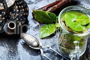 Cup of herbal tea with bay leaf