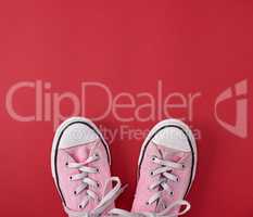 pair of pink old textile sneakers