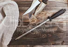 knife with sharpening on the wooden table