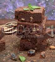 stack of baked square pieces of brownie pie