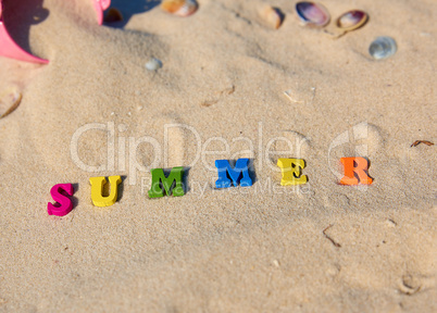 inscription summer from multi-colored wooden letters