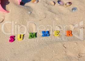 inscription summer from multi-colored wooden letters