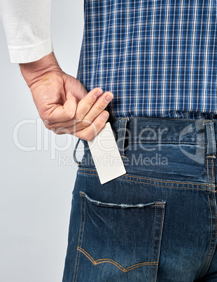 man puts an empty white paper business card