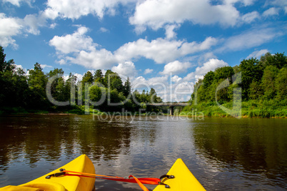 Yellow boat ride by the river. Yellow boat ride by the river.