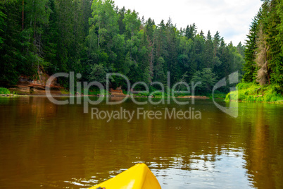Yellow boat ride by the river. Yellow boat ride by the river.
