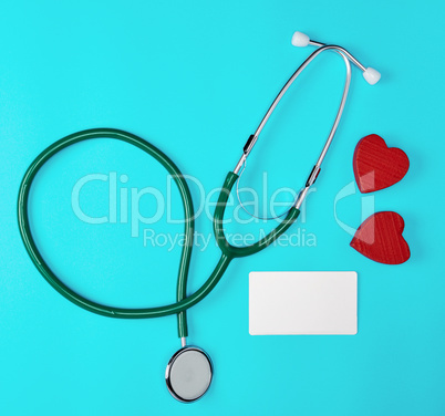 medical stethoscope and empty paper business cards