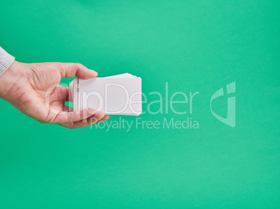 white paper business card in a female hand