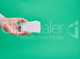 white paper business card in a female hand