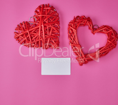 wicker red heart and empty white paper business card