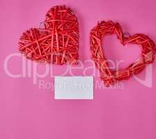 wicker red heart and empty white paper business card