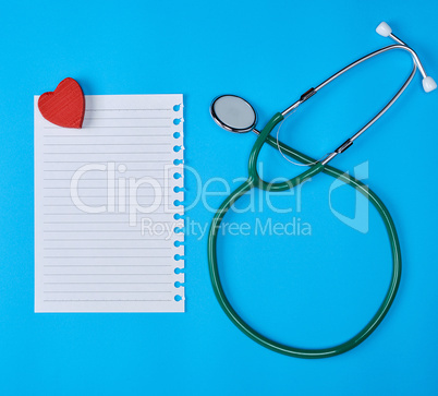 paper in a line and a medical stethoscope