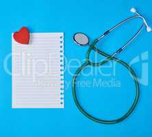 paper in a line and a medical stethoscope
