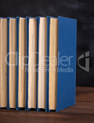 stack of books in a blue cover