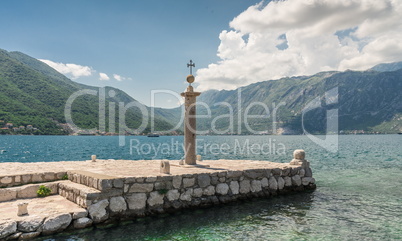 Pier on the island near the old church in Montenegro