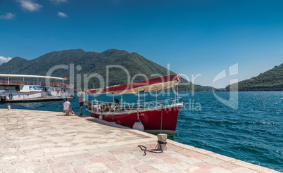Tourists on the pier of the island in Montenegro