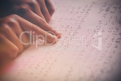 Child using braille to read