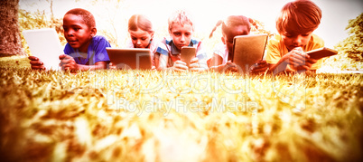 Kids using technology during a sunny day