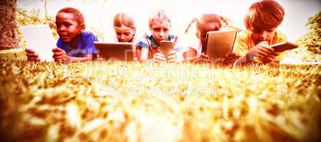 Kids using technology during a sunny day