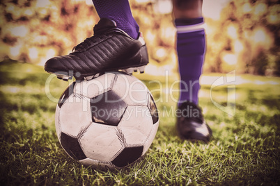 Close up view of balloon under football boots in park