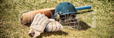 High angle view of cricket equipment on field