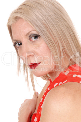 Close up portrait of a blond woman, looking into camera