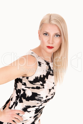 Beautiful blond woman standing in a summer dress