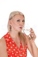 Blond woman gorgeous drinking a glass of water