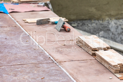 Trowels and New Tile At Pool Construction Site