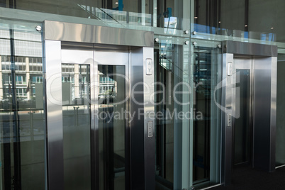 Side view of two elevators in a workplace
