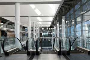 Front view of escalators in first floor of a big workplace
