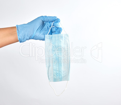hand holding a medical mask