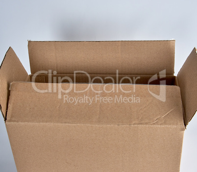 open brown paper box on white background