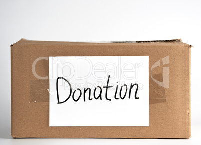 closed brown cardboard box with the inscription donation