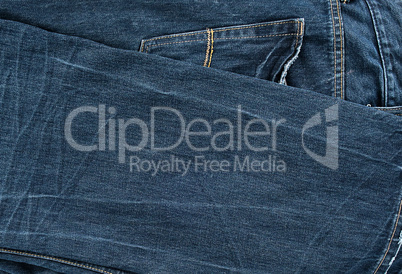 folded blue men's jeans