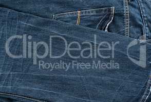 folded blue men's jeans