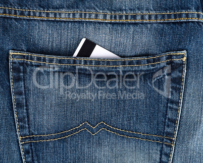 credit card in the back pocket of blue jeans