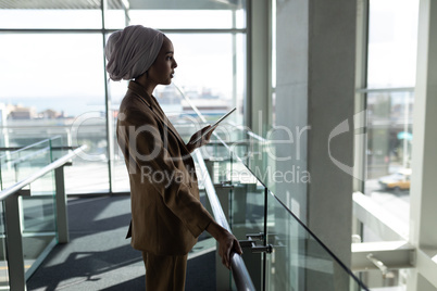 Businesswoman using digital tablet in the office