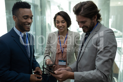 Multi-ethnic business colleague interacting with each other in the elevator