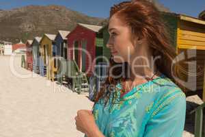 Young Caucasian woman standing on the beach